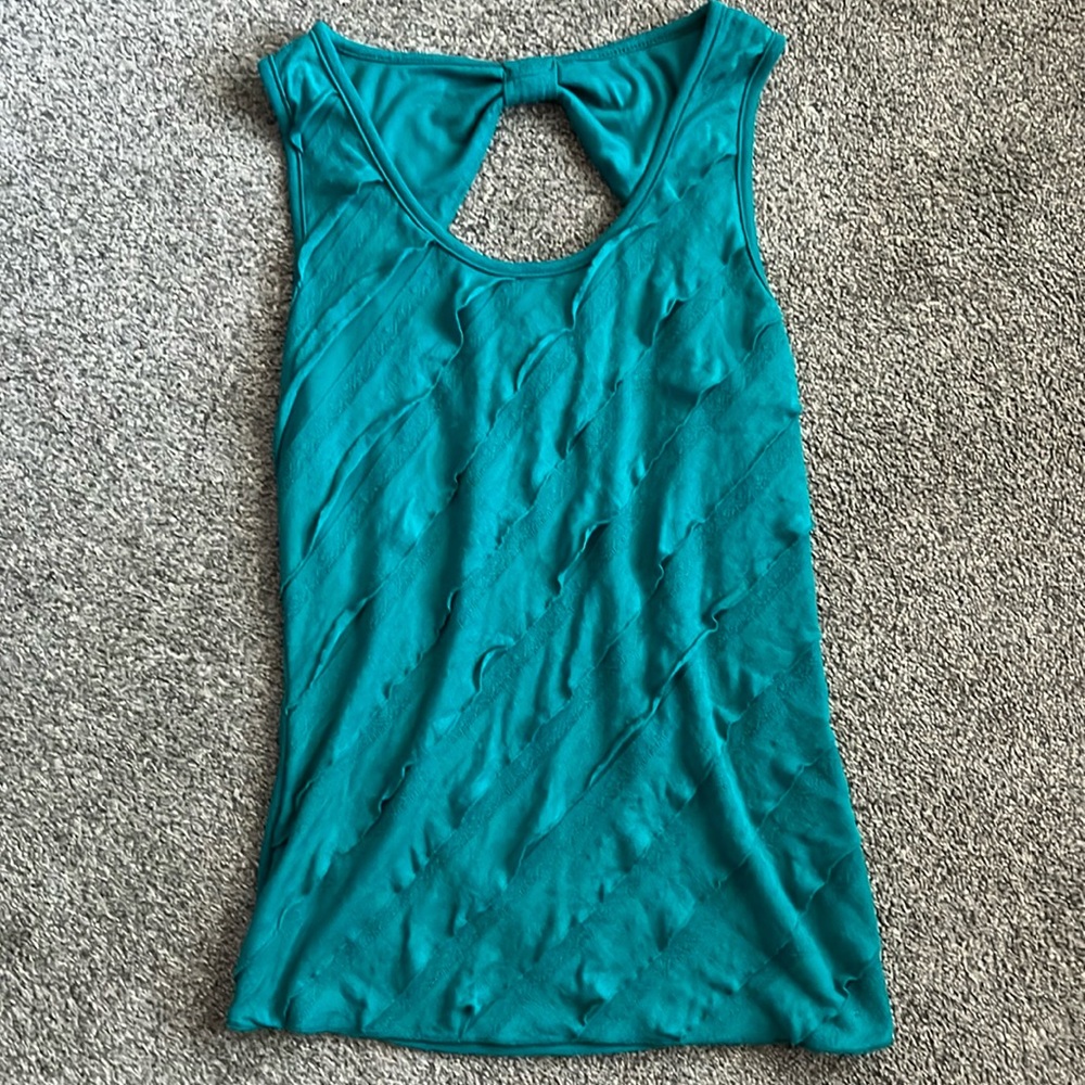 Juniors women’s size small turquoise tank top with the bow on back